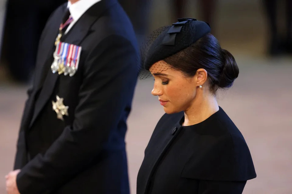 Meghan, Duchess of Sussex looks on as the coffin of Queen Elizabeth II is brought into Westminster Hall on September 14, 2022 in London, United Kingdom. Queen Elizabeth II's coffin is taken in procession on a Gun Carriage of The King's Troop Royal Horse Artillery from Buckingham Palace to Westminster Hall where she will lay in state until the early morning of her funeral. Queen Elizabeth II died at Balmoral Castle in Scotland on September 8, 2022, and is succeeded by her eldest son, King Charles III.