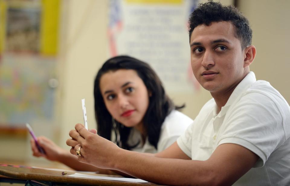 <span class="caption">Immigrant students worry that minor school infractions could lead to deportation. </span> <span class="attribution"><a class="link " href="https://www.gettyimages.com/detail/news-photo/immigrant-students-roberto-pereira-from-honduras-and-maria-news-photo/509000494?adppopup=true" rel="nofollow noopener" target="_blank" data-ylk="slk:Astrid Riecken For The Washington Post via Getty Images;elm:context_link;itc:0;sec:content-canvas">Astrid Riecken For The Washington Post via Getty Images</a></span>