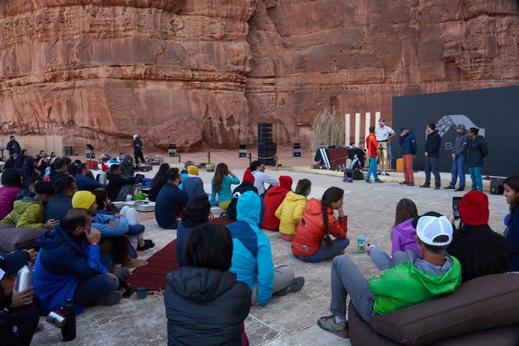 Locals and international climbers gather for presentations following a day of climbing. (Photo: Jake Holland)