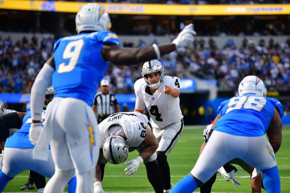 Oct 1, 2023; Inglewood, California, USA; Las Vegas Raiders quarterback Aidan O'Connell (4) scans the line of scrimmage against the Los Angeles Chargers during the second half at SoFi Stadium. Mandatory Credit: Gary A. Vasquez-USA TODAY Sports