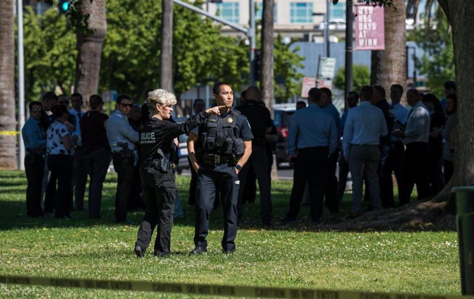 Sacramento police and other law enforcement personnel gather in Winn Park on Saturday, May 20, 2023, following an officer-involved shooting in midtown.