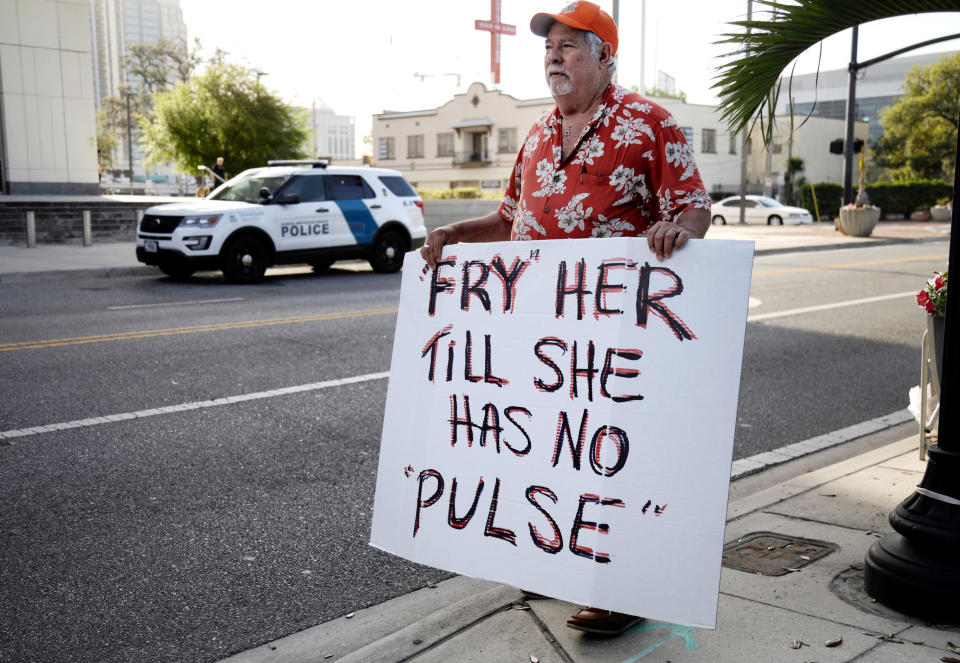 A&nbsp;man protests against Noor Salman,&nbsp;the widow of the Pulse nightclub shooter.&nbsp;Salman is accused of aiding her husband in killing 49 people.&nbsp; (Photo: Stringer . / Reuters)