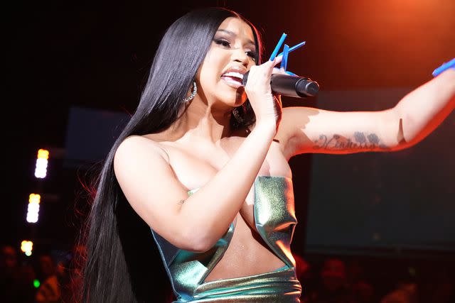 <p>Jeff Kravitz/FilmMagic</p> Cardi B performs at Cardi B and Offset Headline Hall of Fame Party in Arizona in February 2023