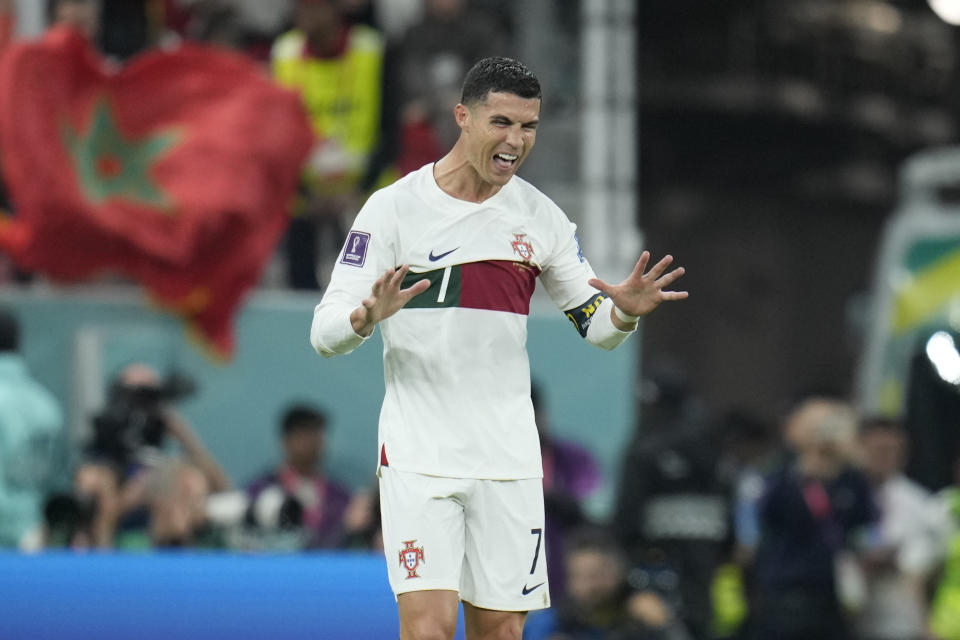 FILE - Portugal's Cristiano Ronaldo gestures during the World Cup quarterfinal soccer match between Morocco and Portugal, at Al Thumama Stadium in Doha, Qatar, on Dec. 10, 2022. Less than two weeks after his great rival Lionel Messi lifted the World Cup, Cristiano Ronaldo has completed a move to Saudi Arabian club Al Nassr and likely signalled the end of his career in elite club soccer. In agreeing a contract until 2025, the five-time Ballon d’Or winner has ended speculation about his future after having his contract terminated by Manchester United last month. (AP Photo/Ricardo Mazalan)