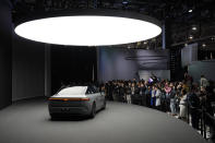 People take pictures of an Afeela EV during a Sony press conference ahead of the CES tech show Monday, Jan. 8, 2024, in Las Vegas. (AP Photo/John Locher)