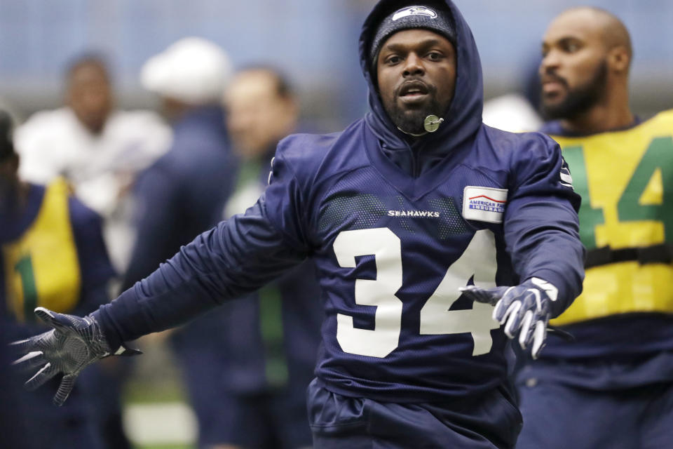 Seattle Seahawks running back Robert Turbin warms up at the NFL football team's practice facility Tuesday, Dec. 24, 2019, in Renton, Wash. Turbin signed with the team a day earlier. (AP Photo/Elaine Thompson)