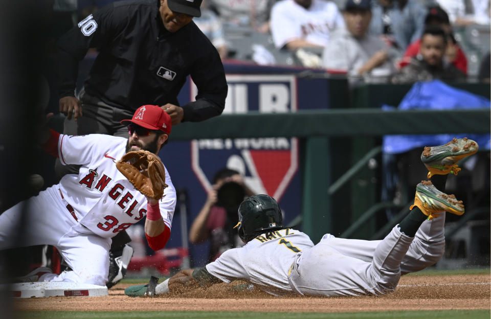 Los Angeles Angels third baseman Michael Stefanic (38) waits for the throw as Oakland Athletics Esteury Ruiz (1) steals third base during the third inning of a baseball game Sunday, Oct. 1, 2023, in Anaheim. (AP Photo/John McCoy)
