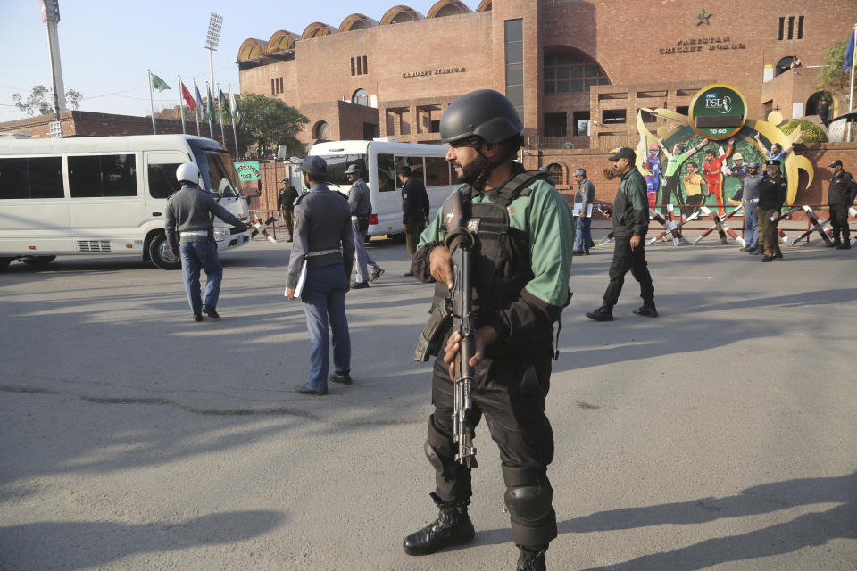 An armed guard stands alert outside the Gaddafi Stadium, Wednesday, Jan. 22, 2020. The three-match Twenty20 cricket series between Pakistan and Bangladesh starts from Friday. (AP Photo/K.M. Chaudary)