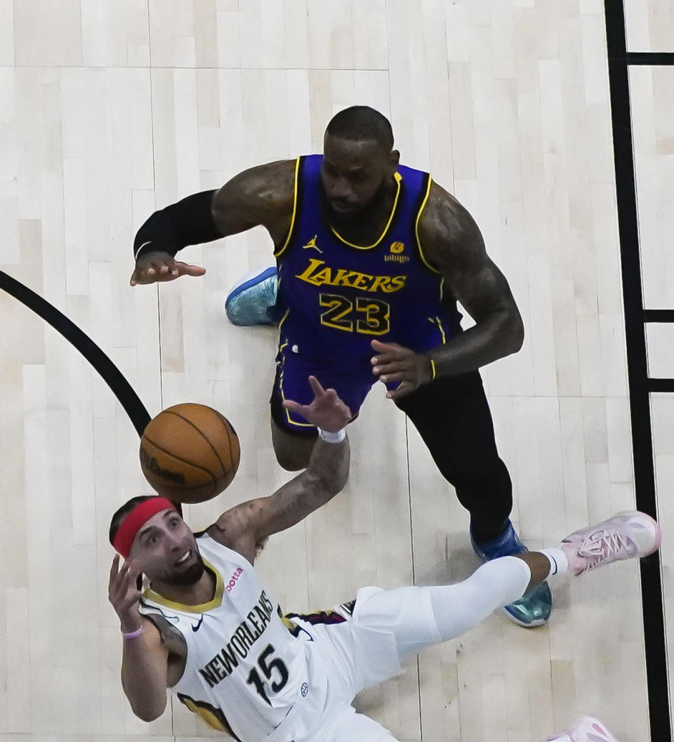 New Orleans Pelicans guard Jose Alvarado (15) steals the ball from Los Angeles Lakers forward LeBron James (23) in the first half of an NBA basketball game in New Orleans, Sunday, Dec. 31, 2023. The Pelicans won 129-109. (AP Photo/Gerald Herbert)