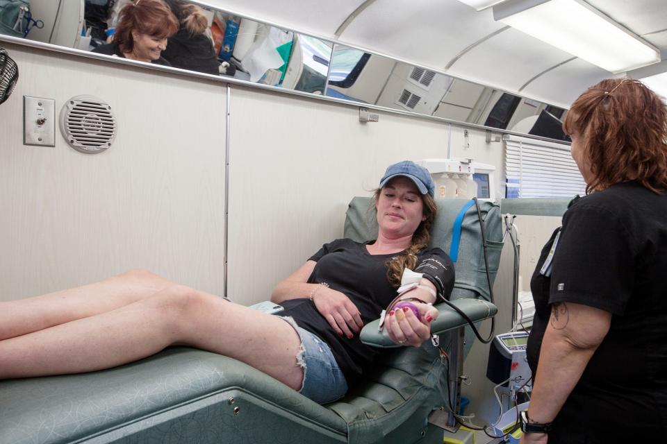 Carolyn Gann donates blood at Archetype Brewing June 15, 2021 in Asheville.