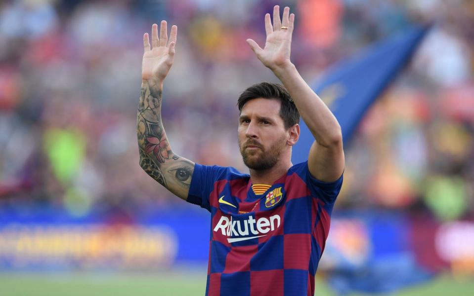 Barcelona's Argentinian forward Lionel Messi waves before the 54th Joan Gamper Trophy friendly football match between Barcelona and Arsenal at the Camp Nou stadium in Barcelona. - AFP