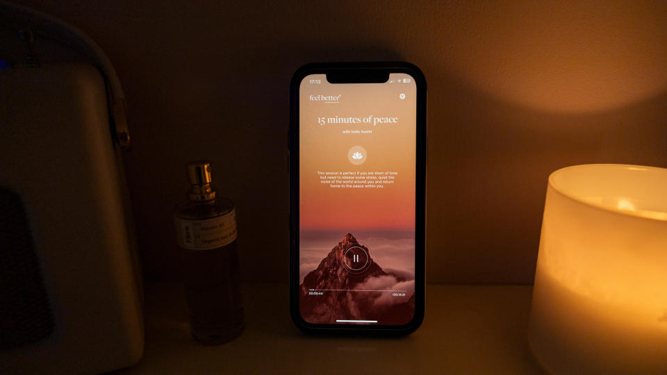 The Feel Better app on an iPhone 12 with a mindfulness session showing on the screen