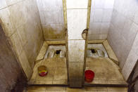 <p>A squat toilet in Dakar, Senegal. (Photo: Seyllou/AFP/Getty Images) </p>