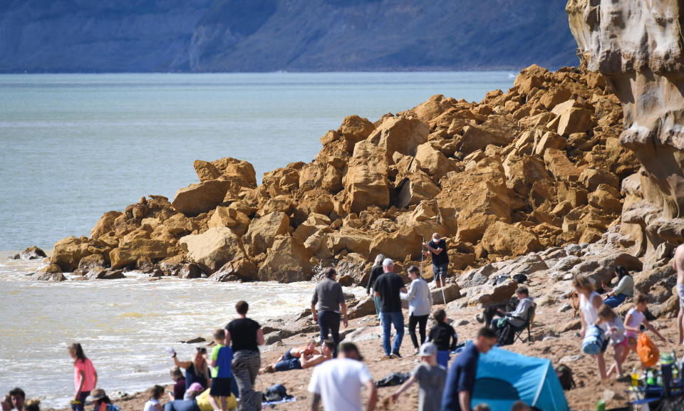 BURTON BRADSTOCK, UNITED KINGDOM - AUGUST 29: General view of the 9,000 ton cliff fall on August 29, 2020 in Burton Bradstock, Dorset, England. The fall happened at Hive Beach near the village of Burton Bradstock shortly before 06:30 BST, Dorset Council said. Fire crews using thermal imaging equipment were called in to check for any trapped casualties but nothing was found. The council described it as a "huge" rock fall and said recent heavy rain had made cliffs unstable. (Photo by Finnbarr Webster/Getty Images)