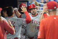 Teammates congratulate Los Angeles Angels' Nolan Schanuel (18) after he hit a home run during the sixth inning of a baseball game against the Miami Marlins, Monday, April 1, 2024, in Miami. (AP Photo/Marta Lavandier)