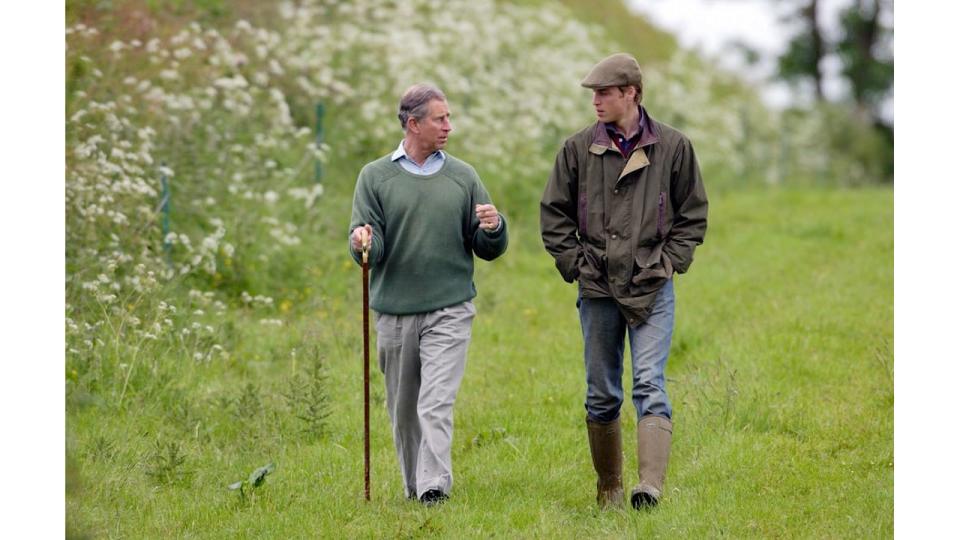 King Charles and Prince William walking in country clothes