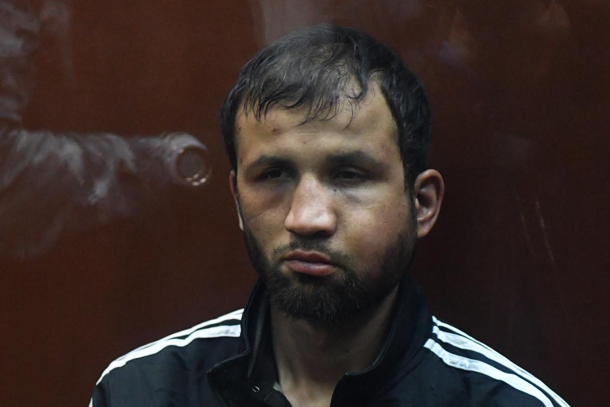 Shamsidin Fariduni appeared the least wounded of the four suspects but his face was heavily swollen (AFP via Getty Images)