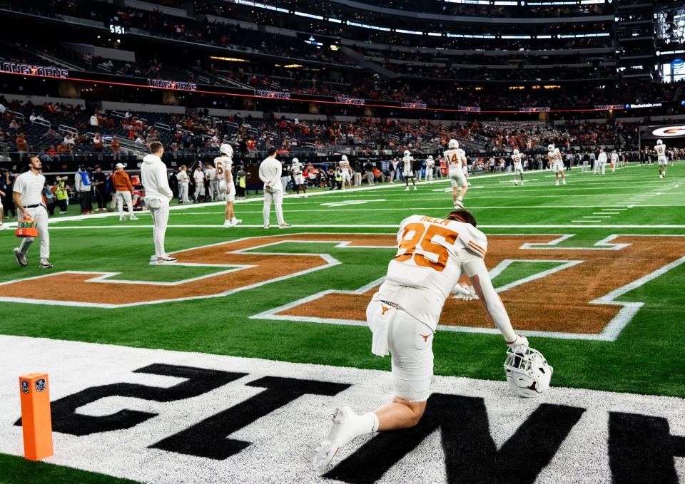 Texas tight end Gunnar Helm takes a moment during warm-ups ahead of the Big 12 championship game at AT&T Stadium in Arlington last December.