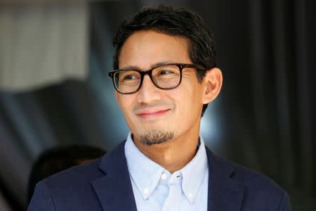 Sandiaga Uno, who is the vice-presidential candidate for Prabowo Subianto, smiles after delivering a media briefing about taking the election result for a constitutional court challenge, in Jakarta, Indonesia, May 24, 2019. REUTERS/Willy Kurniawan