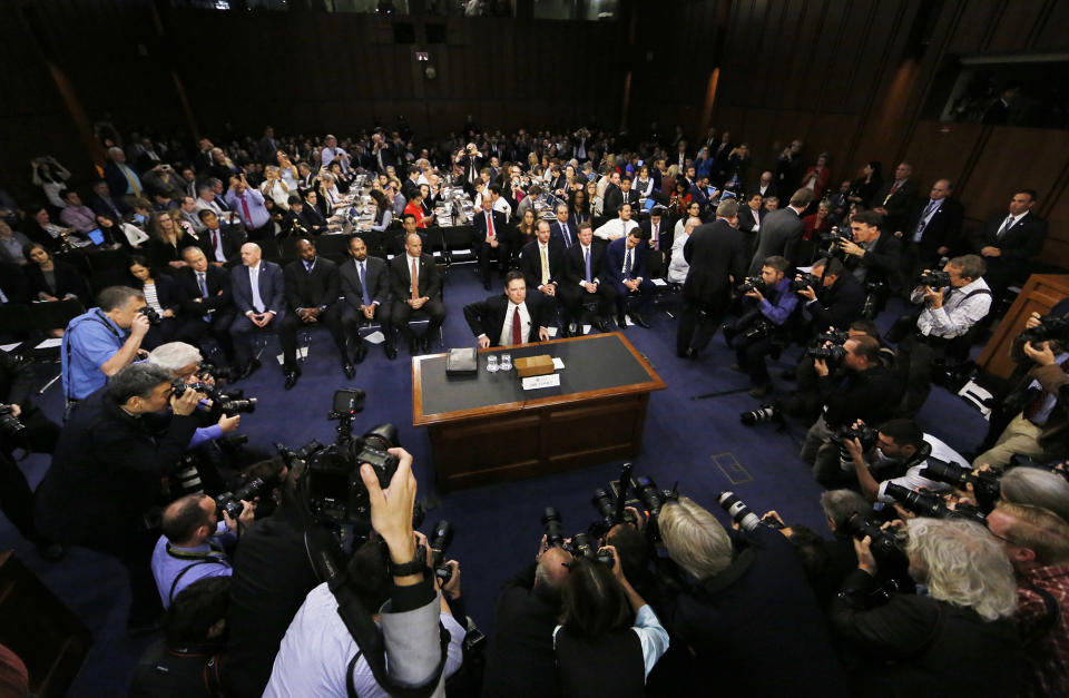 Former FBI director James Comey takes his seat