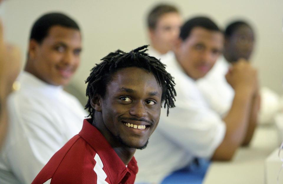 During his college signing party in 2006, Jamar Taylor chuckles at the jesting from coach Bill Castle about going to the University of Alabama with his teammates behind him.