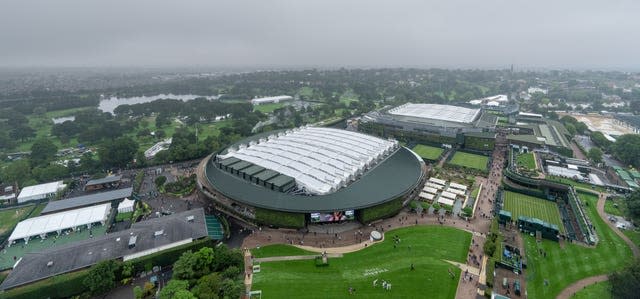 The roofs were on Centre Court and Court One as poor weather marked the start of Wimbledon