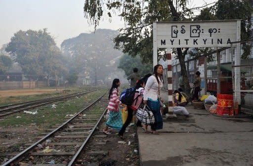 This file photo shows local women crossing railway tracks near a train station in Myitkyina, northern Kachin state, in February. Myanmar troops have committed serious rights abuses against civilians in the area in an offensive against ethnic rebels that has forced tens of thousands to flee their homes, according to Human Rights Watch