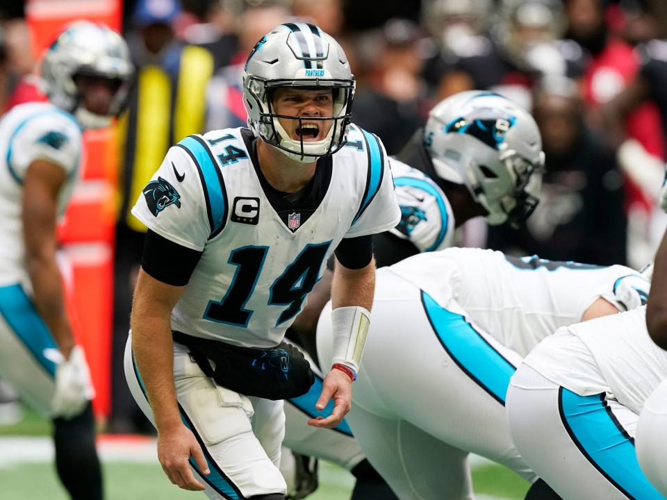 Sam Darnold adjusts a play at the line against the Atlanta Falcons.