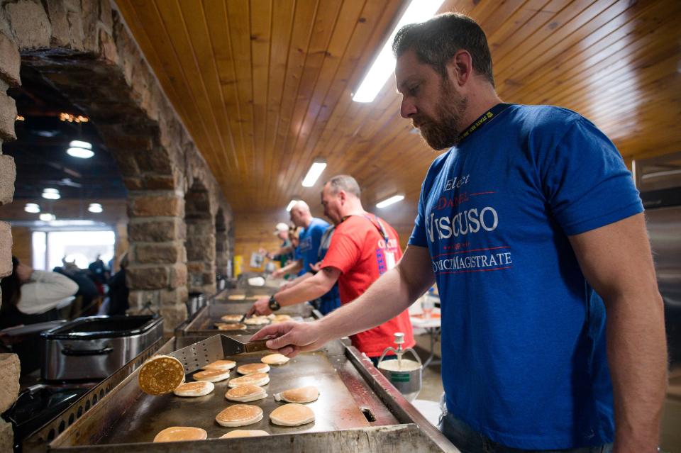 Dan Viscuso of New Brighton flips pancakes during the Maple Syrup Festival Sunday at Bradys Run Park.