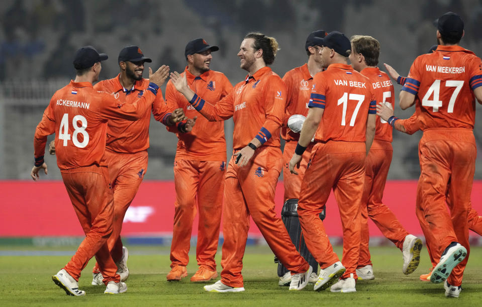 Netherlands players celebrate the wicket of Bangladesh's Mahmudullah Riyad during the ICC Men's Cricket World Cup match between Bangladesh and Netherlands in Kolkata, India, Saturday, Oct. 28, 2023. (AP Photo/Bikas Das)