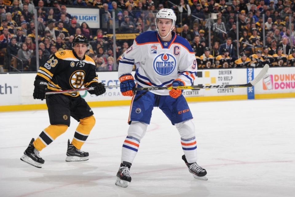 Art Ross contenders Connor McDavid and Brad Marchand went head-to-head in a game with playoff implications for their teams. (Photo by Steve Babineau/NHLI via Getty Images)