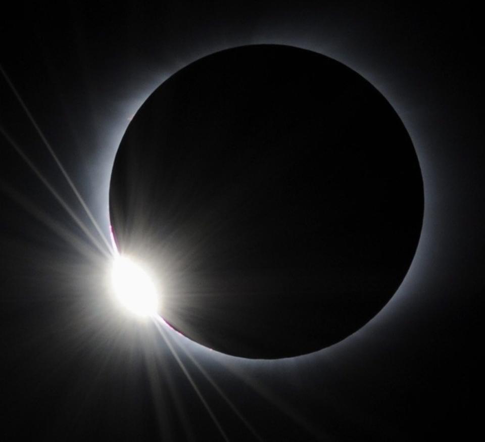 The diamond ring shines during a total solar eclipse observed from a ship sailing near Kita Iwojima, 1,040 kilometers (650 miles) south of Tokyo, Japan, at 11:26 a.m. on Wednesday, July 22, 2009.  The longest solar eclipse of the 21st century. Much of Asia, from India to China, was plunged into darkness on Wednesday as millions of people gathered to watch the event.  (AP Photo/Kyodo News, Akiko Matsushita) ** EXIT JAPAN, MANDATORY CREDIT, FOR COMMERCIAL USE IN NORTH AMERICA ONLY **