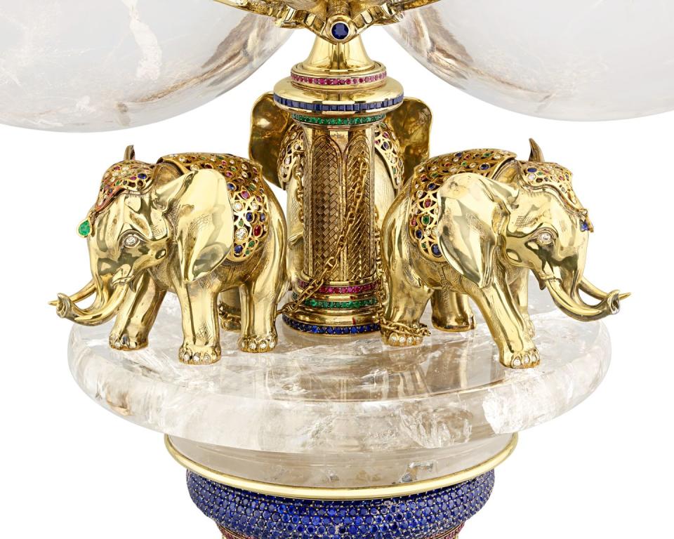 a vase with elephants on it