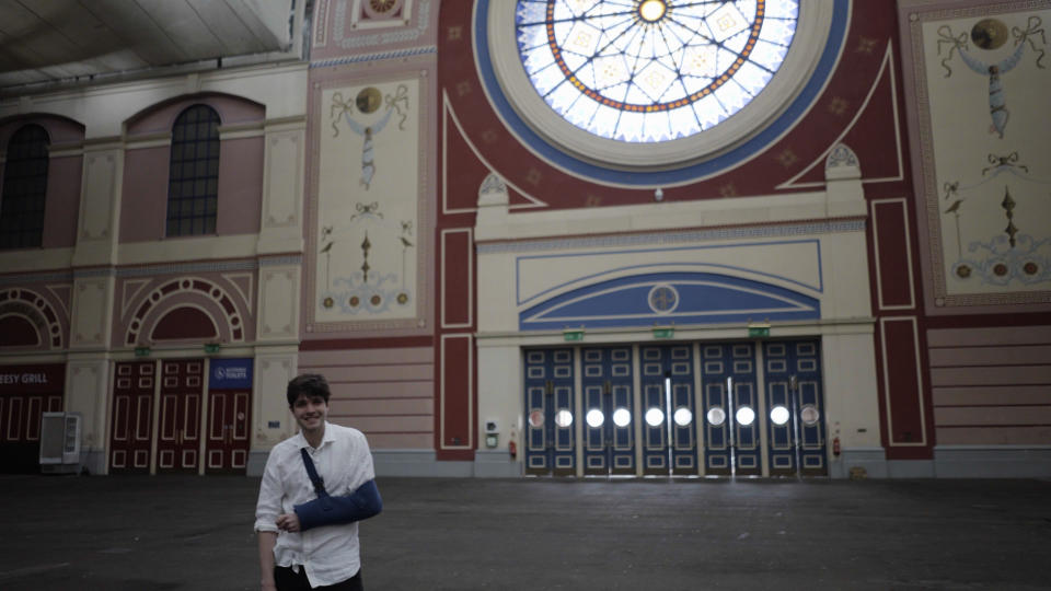 History PhD student Patrick Hegarty Morrish explores the hidden history of the Great Hall at Alexandra Palace in London. (Historic England/ PA)