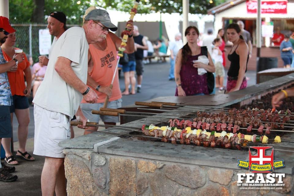 Carne de Espeto being cooked at the Feast of the Blessed Sacrament.