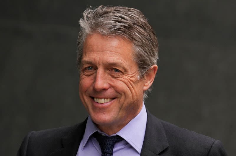 FILE PHOTO: Hugh Grant walks outside the High Court, in London