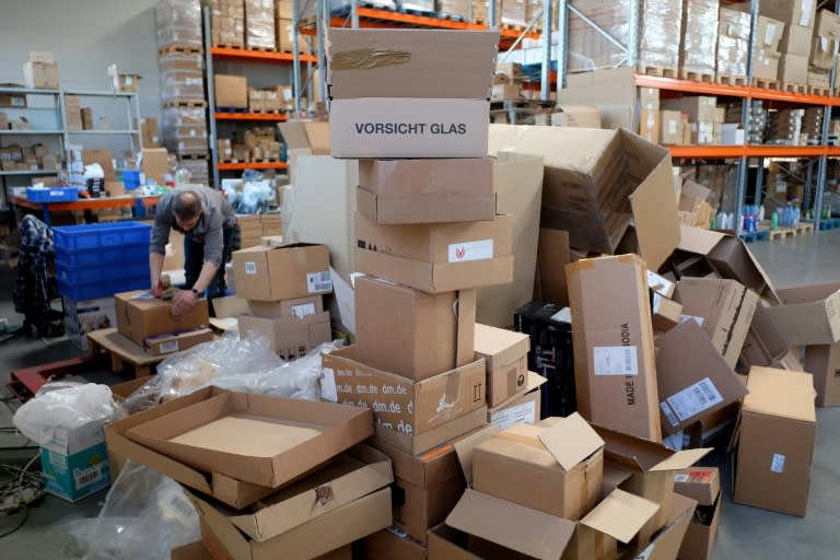 An employee sorts products at a warehouse of the non-profit Innatura cooperative, in Cologne, western Germany