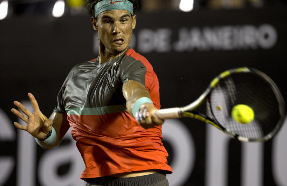 Rafael Nadal, of Spain, returns the ball to Albert Montanes, of Spain, at the Rio Open tennis tournament in Rio de Janeiro, Brazil, Thursday, Feb. 20, 2014. (AP Photo/Silvia Izquierdo)