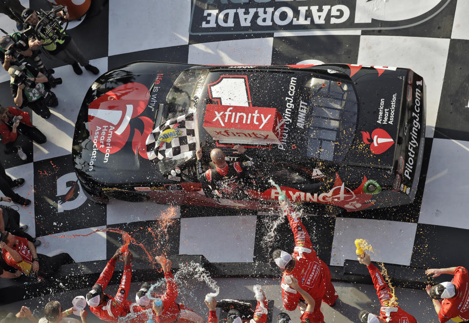 Michael Annett gets doused in Victory Lane after winning the NASCAR Xfinity auto race Saturday, Feb. 16, 2019, at Daytona International Speedway in Daytona Beach, Fla. (AP Photo/Chris O'Meara)