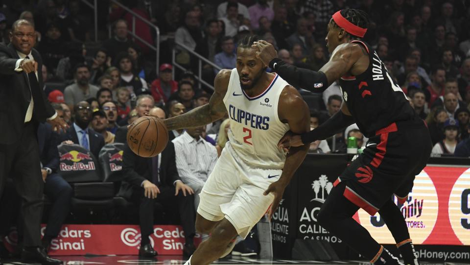 Nov 11, 2019; Los Angeles, CA, USA; LA Clippers forward Kawhi Leonard (2) drives to the basket against Toronto Raptors forward Rondae Hollis-Jefferson (4) during the first half at Staples Center. Mandatory Credit: Richard Mackson-USA TODAY Sports