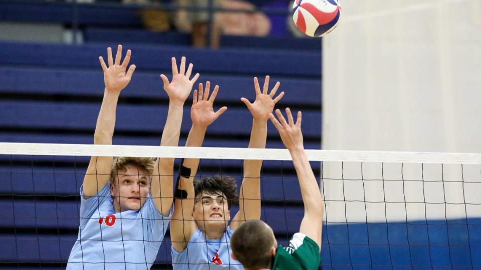West Jessamine’s Ivan Chen (10) and Josh Stowe (8) attempt to block a tip during the Colts’ match against Trinity in the KVCA boys’ volleyball state semifinals at Henry Clay on Wednesday.