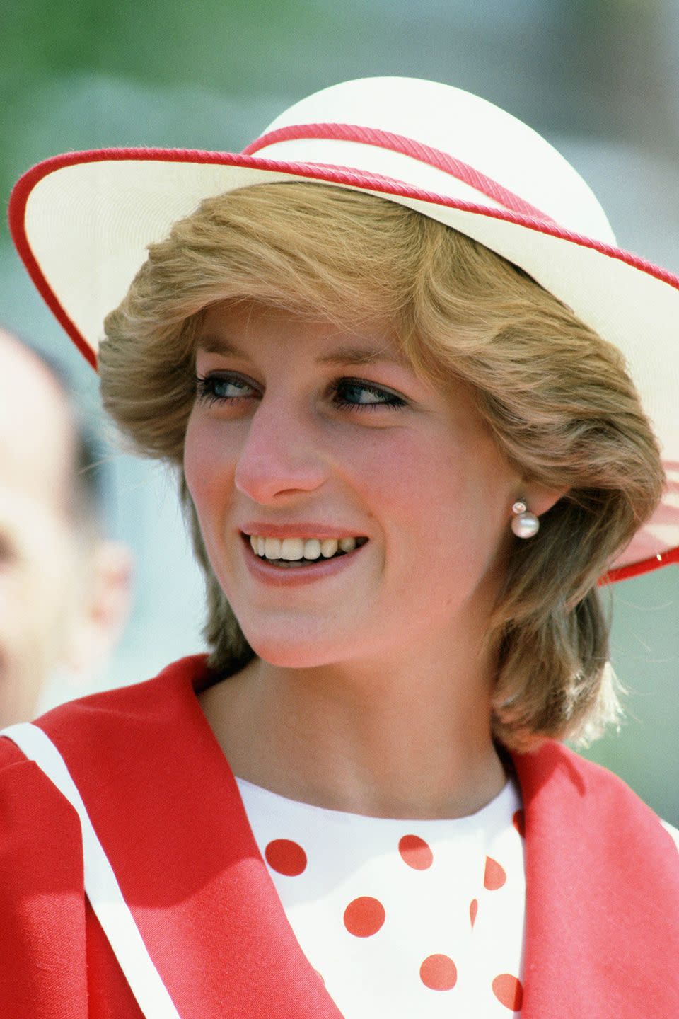 <p>In a jaunty red-and-white hat while visiting Canada.</p>