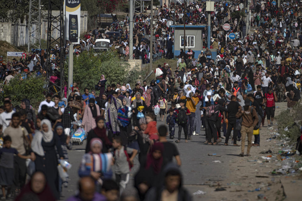 Palestinians flee to the southern Gaza Strip on Salah al-Din Street in Bureij, Gaza Strip, Friday, Nov. 10, 2023. (AP Photo/Fatima Shbair)