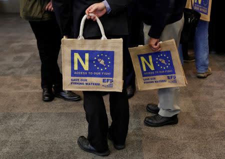 Delegates hold bags during the UKIP party conference in Birmingham, Britain September 21, 2018. REUTERS/Darren Staples/Files