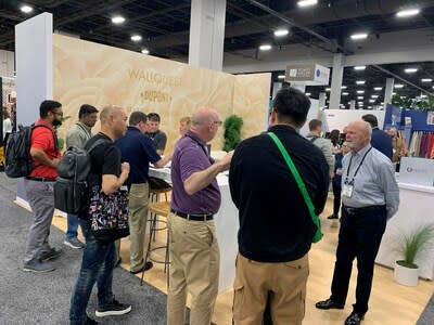 Booth visitors participated in cleanability demonstrations by drawing with sharpie on Tedlar® protected wallpaper