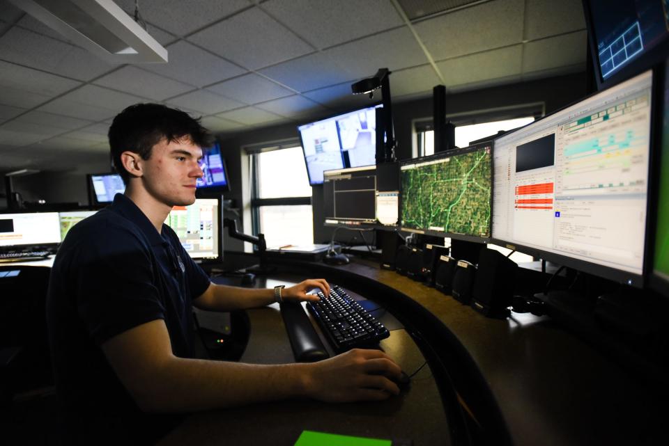 Eaton County 911 dispatcher Nick Smith, 18, pictured Tuesday, Feb. 21, 2023, at the helm of his workspace at the Eaton County Central Dispatch Center in Charlotte.