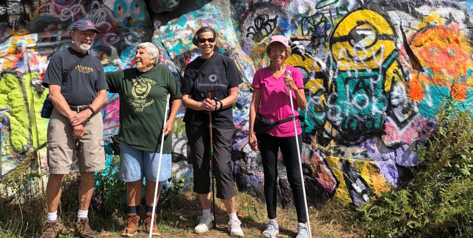 Loraine Sumner, 86, of Milton, second from left, leads a hike at the Quincy quarries for the Milton Senior Center on Saturday Sept. 3, 2022. From left, Jeff Smith, Sumner, Barbara Smith, and Betty Jean Regan.