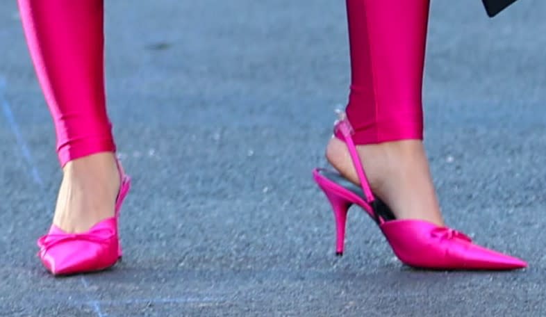 Emily Ratajkowski wearing hot pink slingback pumps