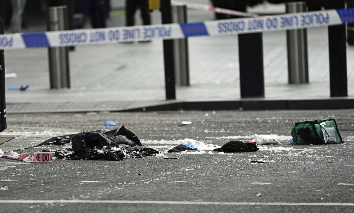 Items in the street at the scene in Shaftesbury Avenue, where two male police officers were stabbed, in London, Friday, Sept. 16, 2022. London’s police force says two officers have been hospitalized after being stabbed in central London early Friday. It says the attack is not being treated as terrorism. The Metropolitan Police force says officers “encountered a man with a knife” in the Leicester Square area, a busy tourist hub, at around 6 a.m. (Aaron Chow/PA via AP)