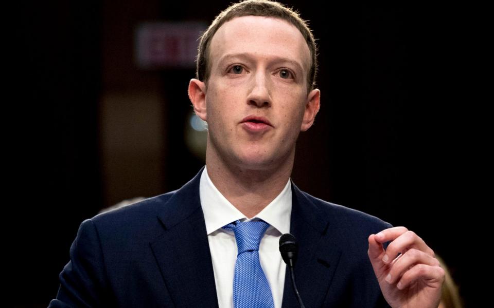 In this April 10, 2018, file photo, Facebook CEO Mark Zuckerberg testifies before a joint hearing of the Commerce and Judiciary Committees on Capitol Hill in Washington - Andrew Harnik/AP